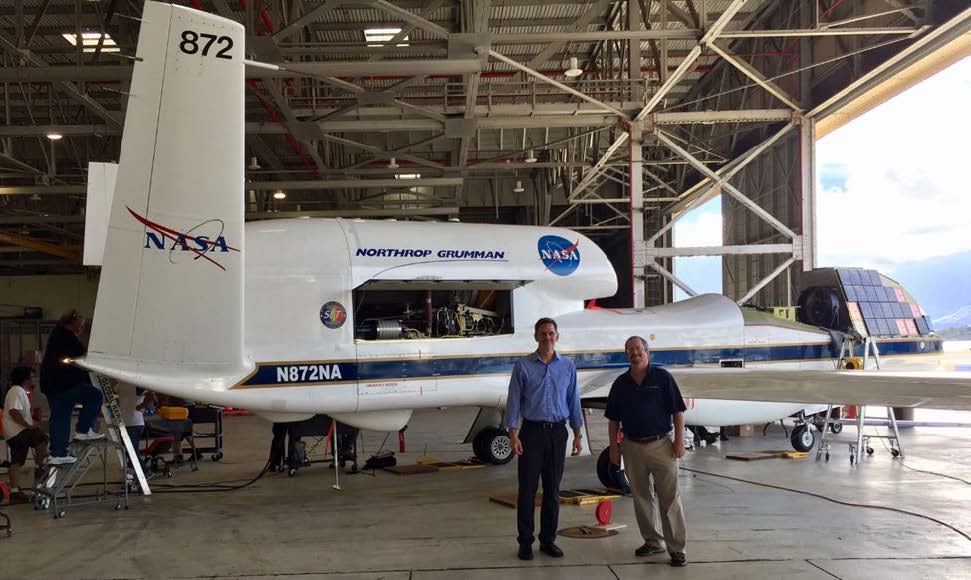 Rich Igo next to a NASA Global Hawk in Hawaii